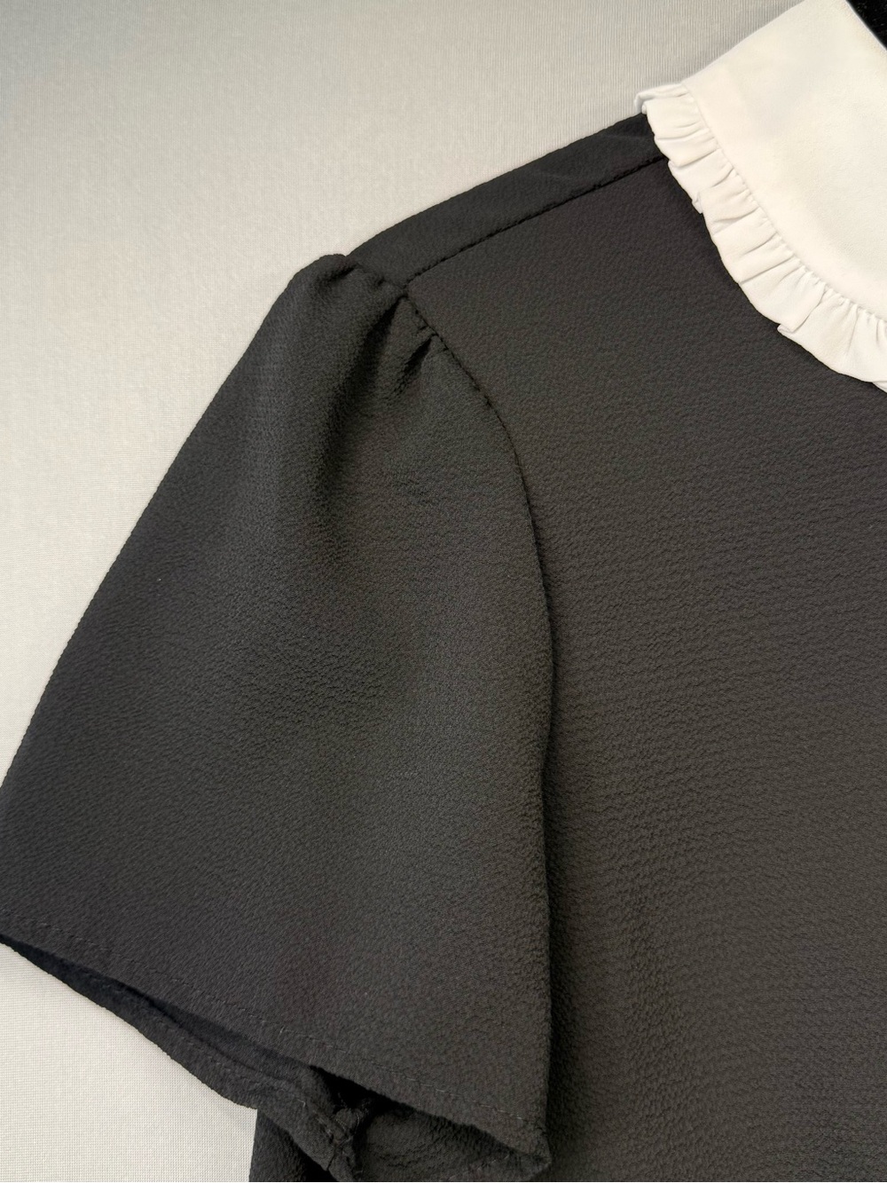 CeCe Black Short-Sleeve Blouse with White Ruffle Peter Pan Collar and Neck Tie - Picture 12 of 12